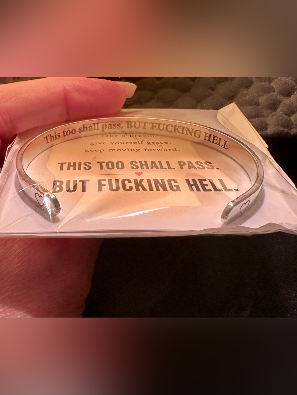 Silver bracelet with inspirational (yet funny) saying.
